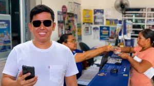 Inició el segundo ciclo de 500 mil para damnificados: verifique si recibe el pago 2 Imagen de Wintor ABC con celular y de fondo mujer cobrando giro, Se acerca el segundo ciclo de linea de emergencias 500 mil